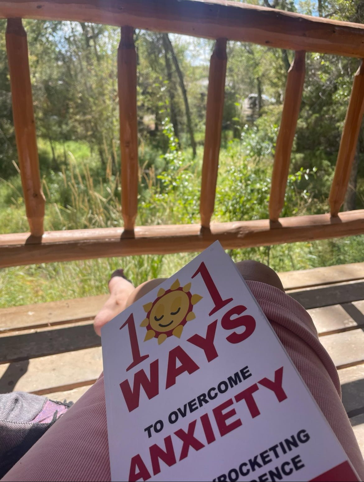 Amber sitting with 101 book outside